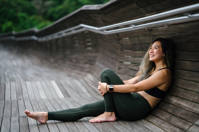 young yoga instructor outdoors smiling