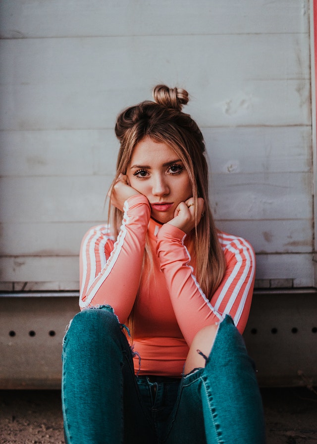 sad woman sitting indoors