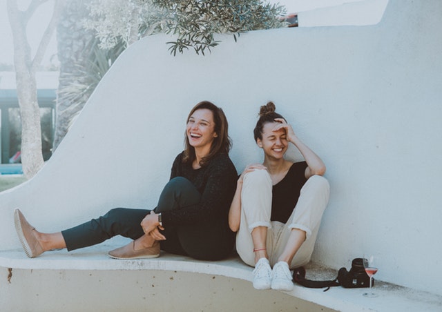 women sitting outdoors