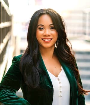 Therapist Diem Phan headshot outdoors wearing a green jacket