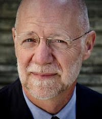 Patrick Duiven's Headshot outdoors with a brick background