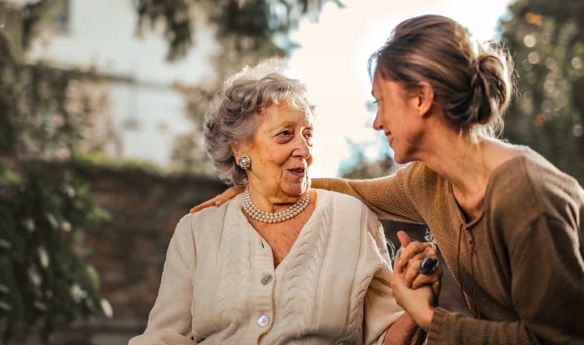 stock image of two women holding hands