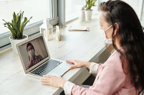 Woman working from home during COVID