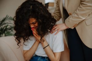 woman crying during therapy session