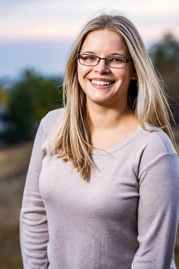 Therapist Emily Cunningham outdoors wearing a light colored shirt