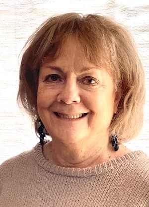 Therapist Connie Cory headshot wearing a tan sweater