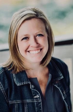 Therapist Rachel Mahoney smiling while standing outdoors