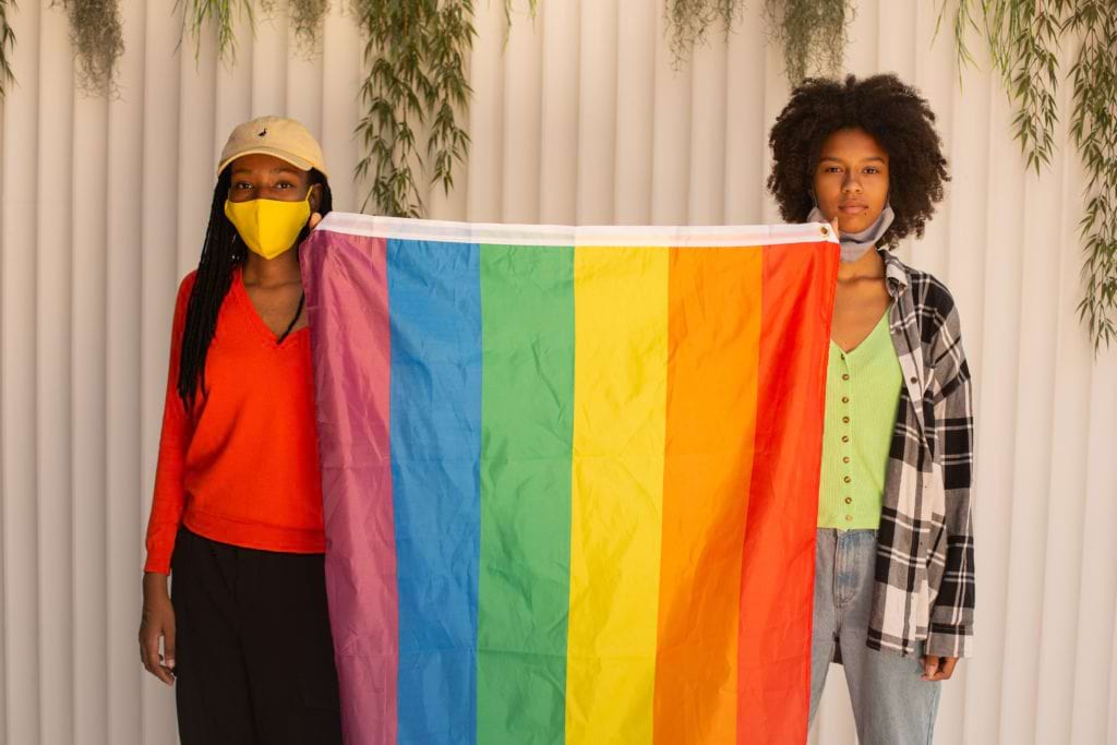2 ladys inside with lgbt flag