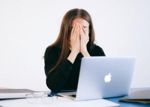 anxious woman by her computer