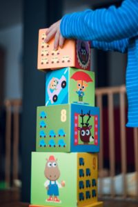 child playing with large building blocks