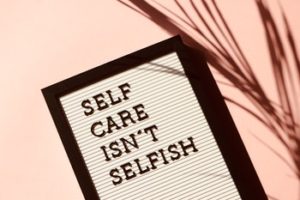 sign that reads "self care isn't selfish".