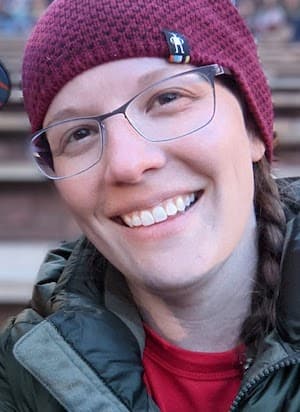 Therapist Aleea Shaw outside wearing a winter coat and read beanie