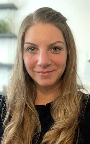 Therapist Sarah Severino headshot indoors wearing a black top