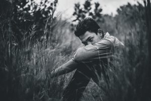 Man sitting in feild