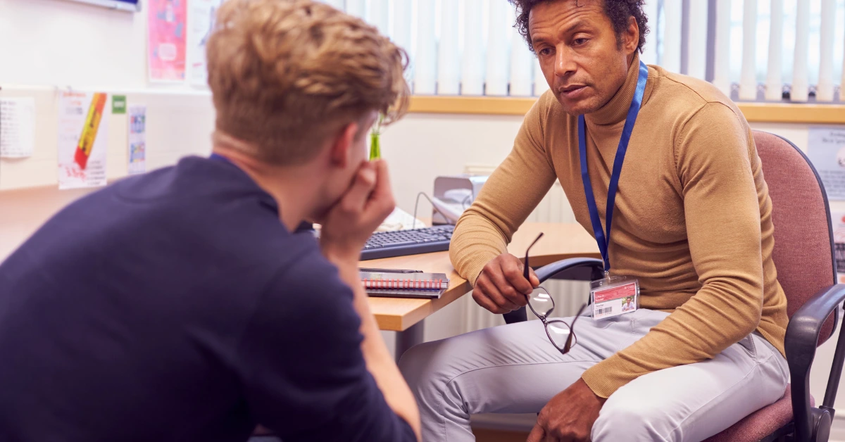 Therapist providing stress management counseling to a client in a Denver office